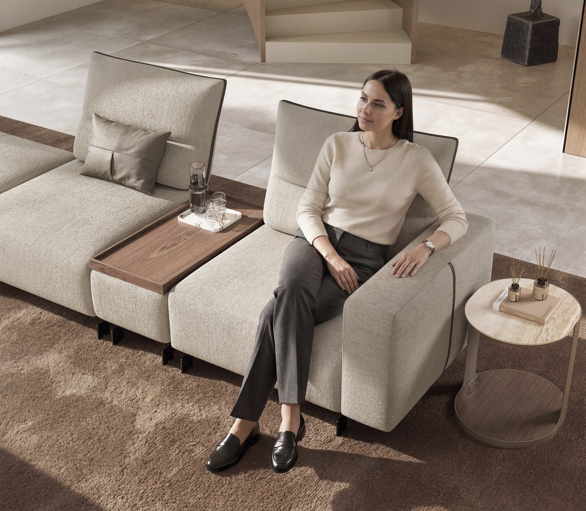 Elegant beige sofa with wooden side table, perfect for contemporary living rooms.