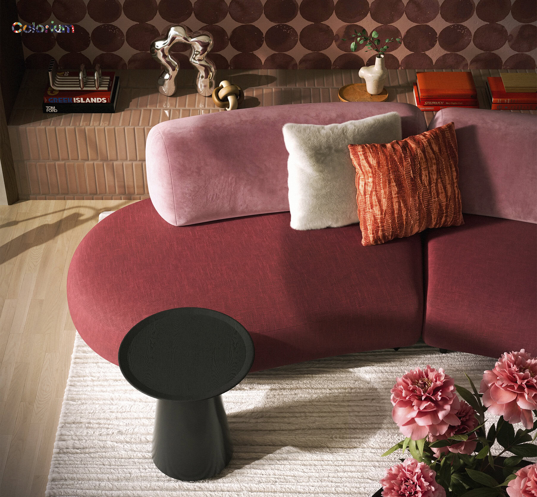 Stylish pink velvet sofa with plush cushions and a black accent table in a contemporary living room setting. Perfect for modern home decor and comfortable lounging.