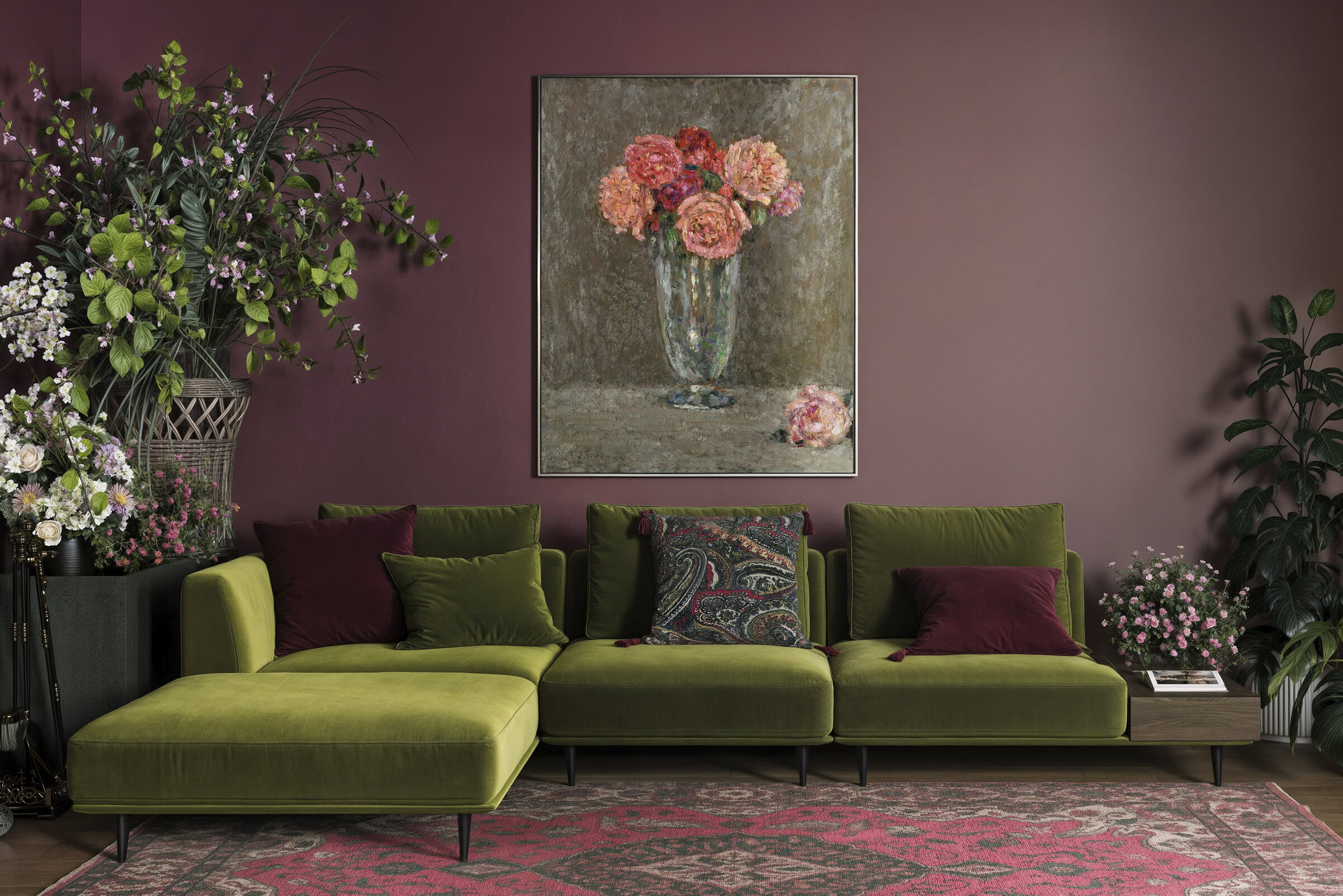 Stylish green sectional sofa in a modern living room with floral artwork and lush plants, perfect for contemporary home decor.