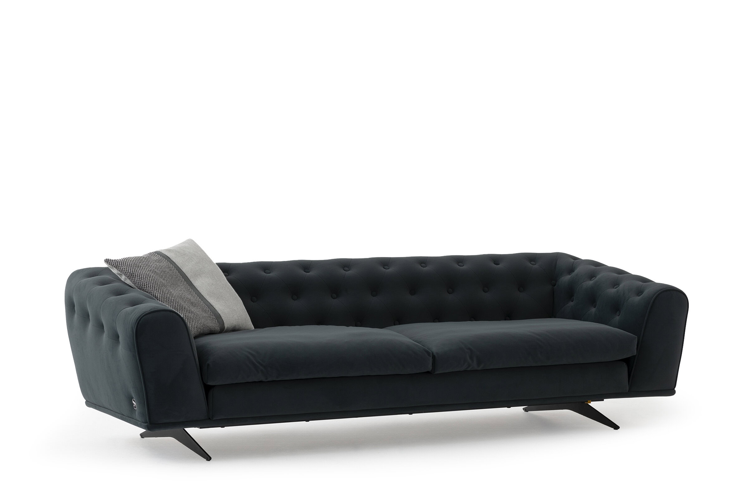 Luxurious dark velvet sofa with tufted backrest, ideal for stylish living spaces and contemporary home décor.