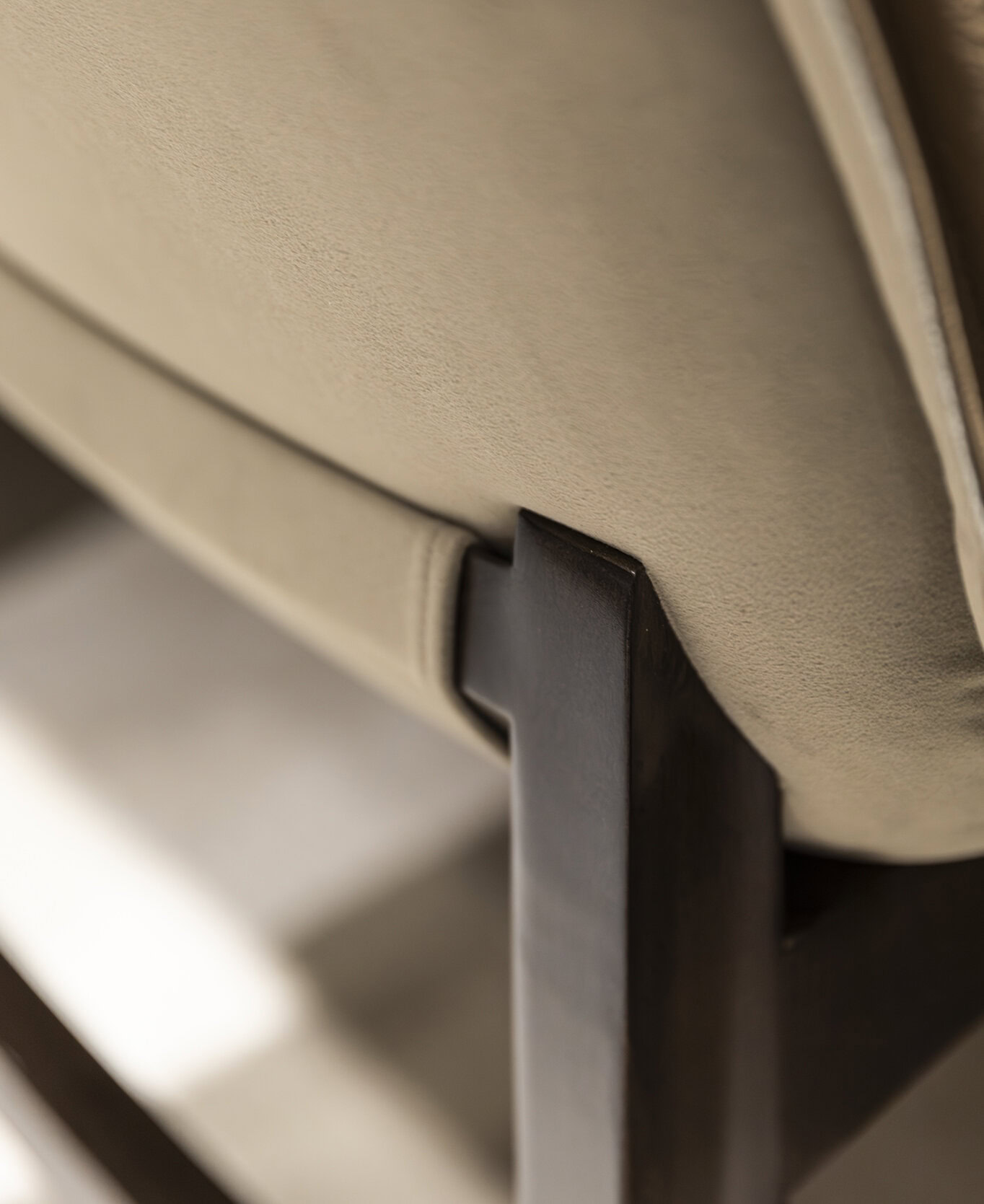 Elegant beige upholstered furniture with dark wooden legs, showcasing modern design and quality craftsmanship in living room or lounge settings.