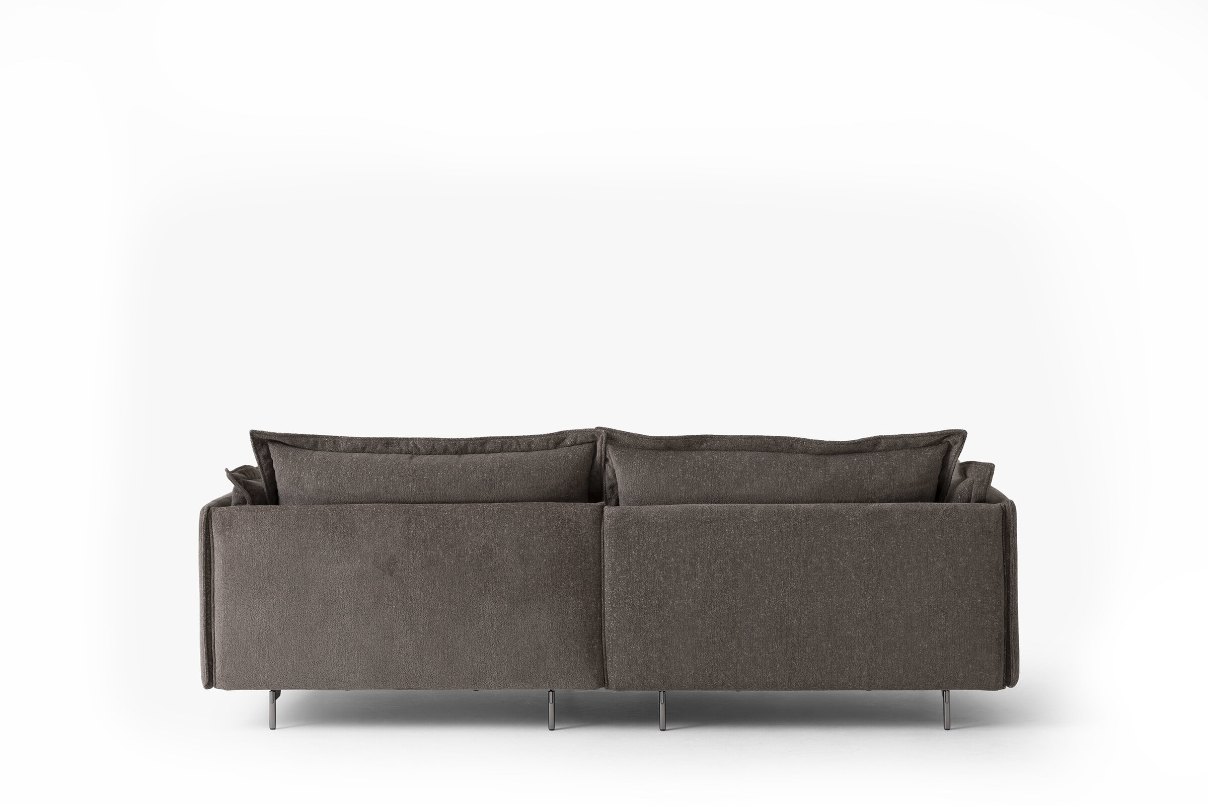 Brown sofa with plush cushions, ideal for contemporary living spaces. Crafted with high-quality fabric and sleek metal legs, offering comfort and style.