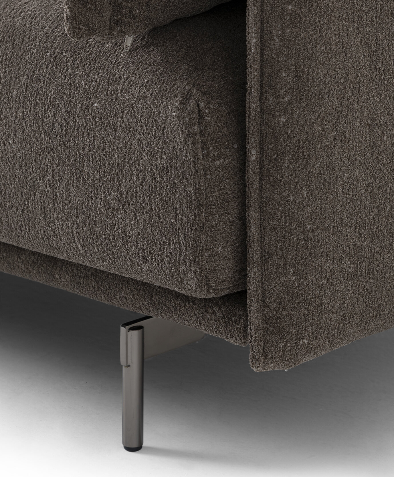 Brown fabric sofa with sleek metal leg, perfect for contemporary living rooms. Crafted for comfort and style, this furniture piece adds elegance to any space.