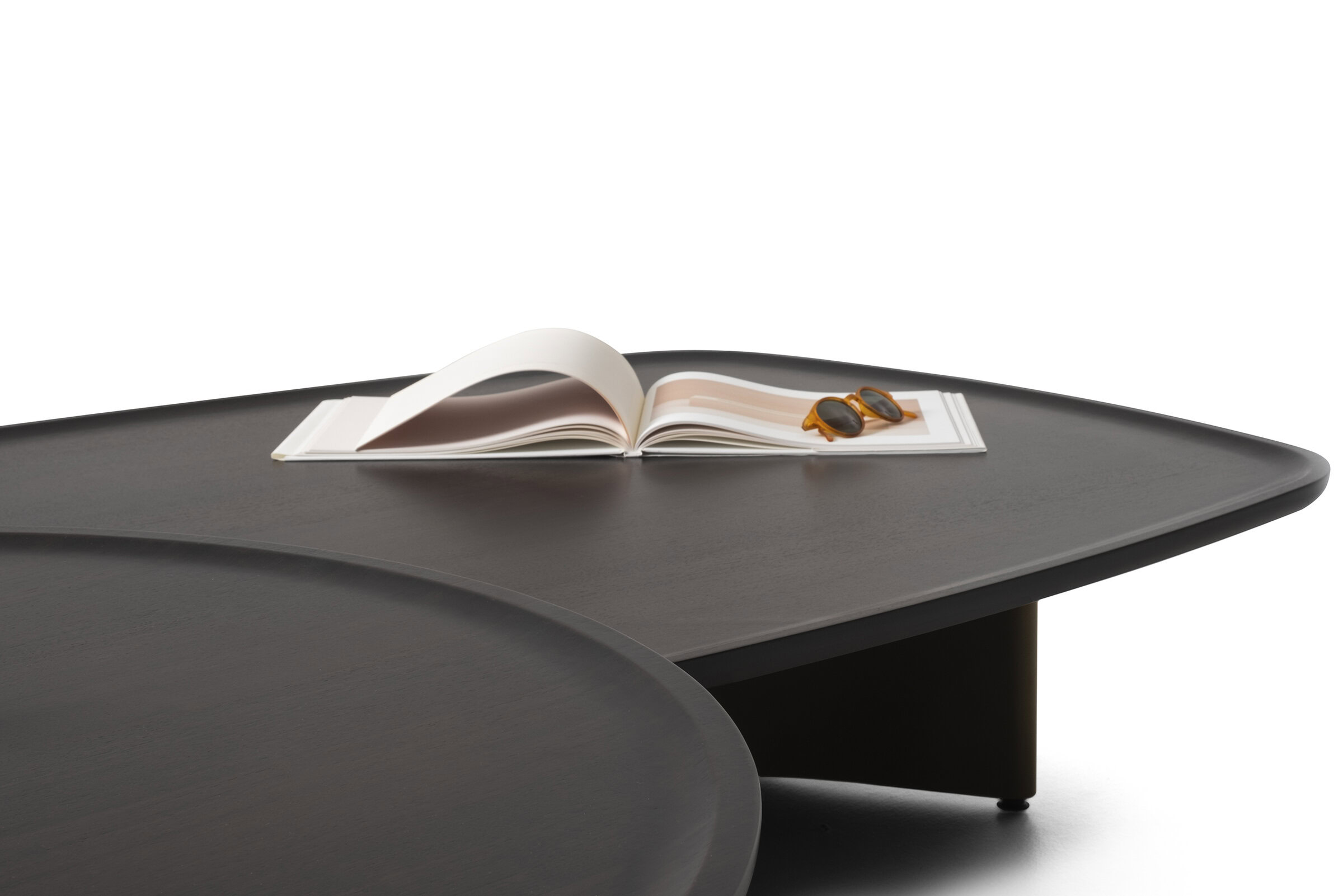 Sleek modern dark wood coffee table with smooth finish, perfect for contemporary living room decor. Features curved edges and sturdy design for stylish functionality.