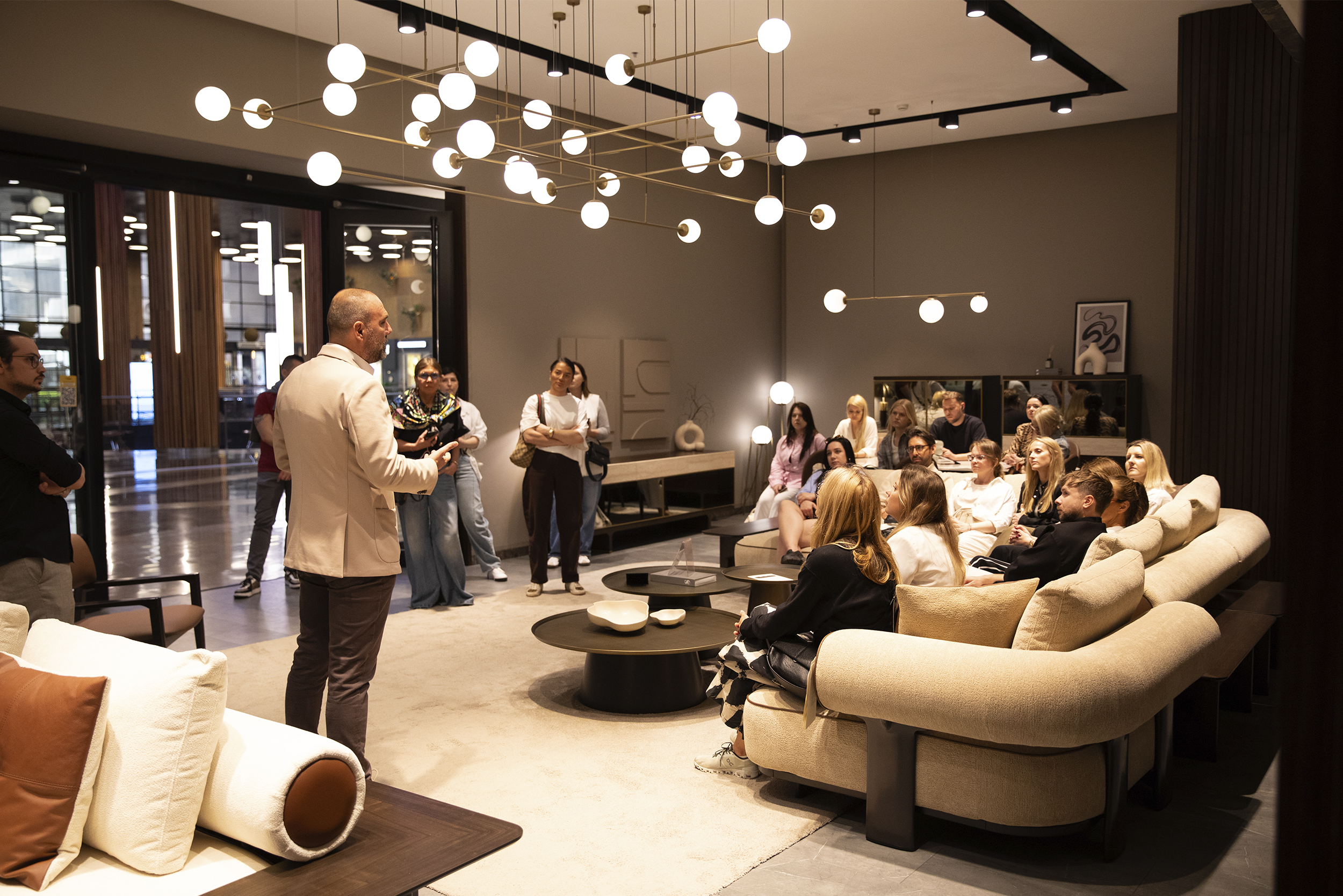 Elegant modern living room with stylish sofas and contemporary lighting.