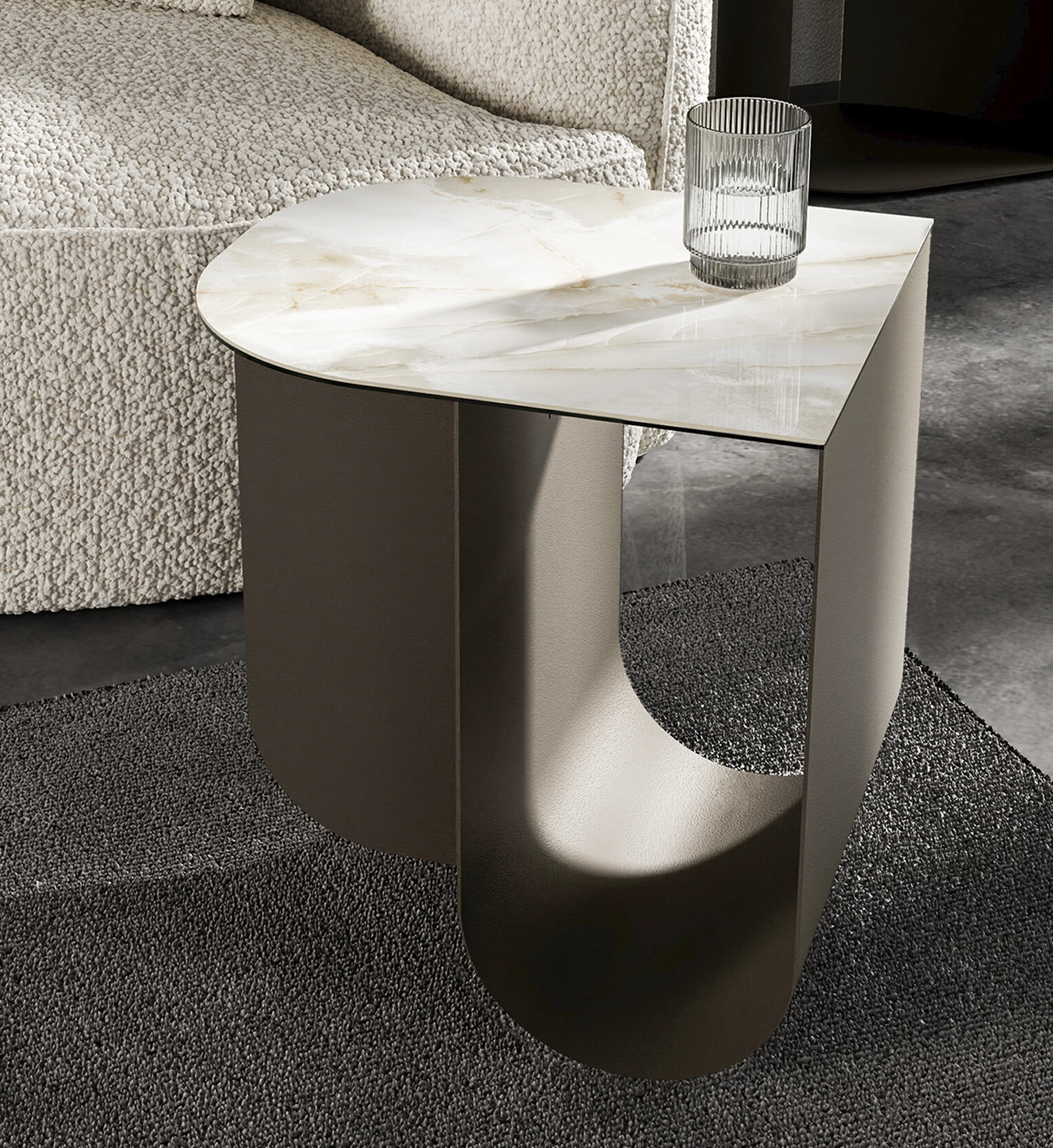 Contemporary marble side table with a unique curved metal base, perfect for modern living rooms and stylish interior decor.
