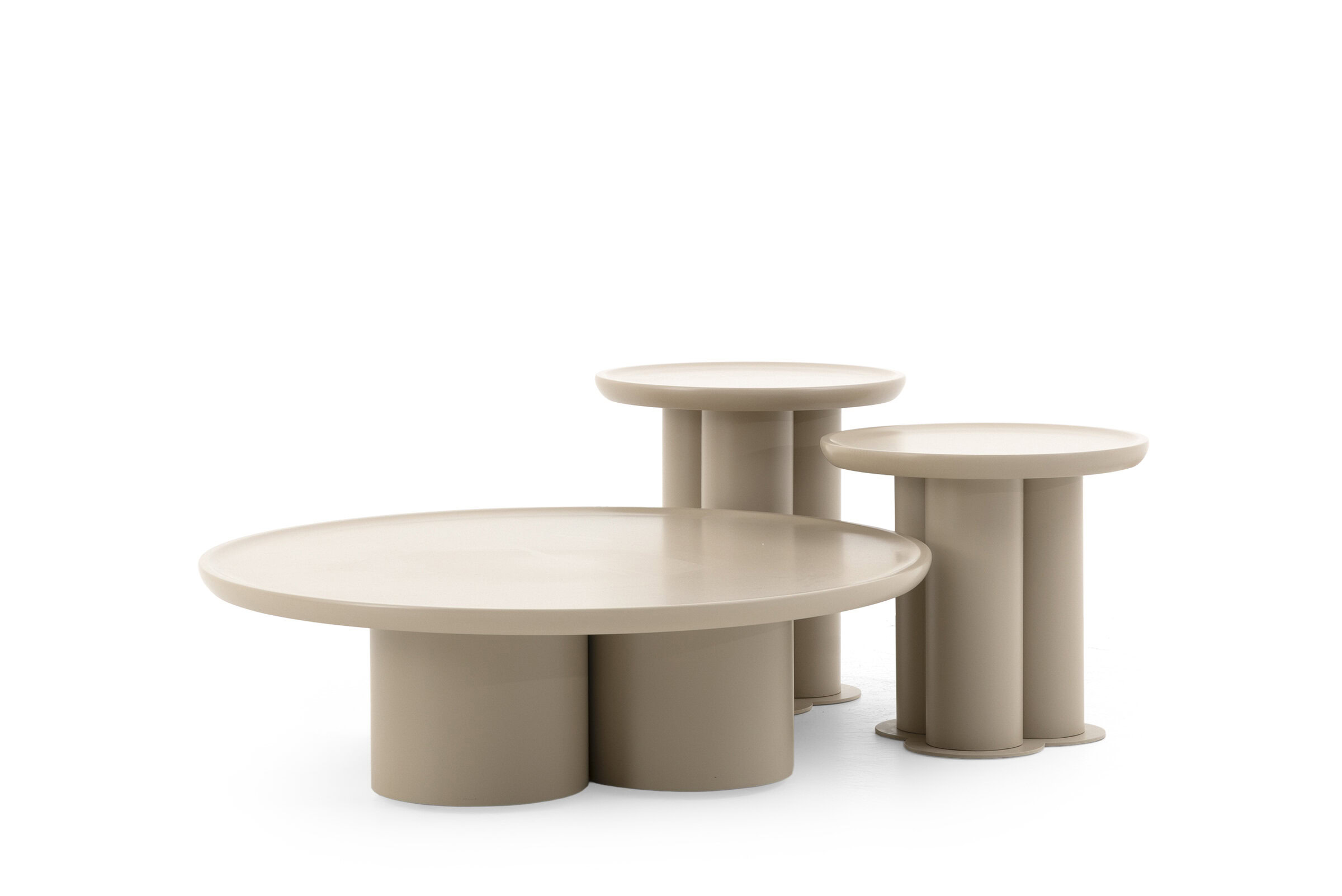 Sleek beige modern nesting coffee tables set of three, smooth round surfaces on cylindrical bases, perfect for stylish living room décor.