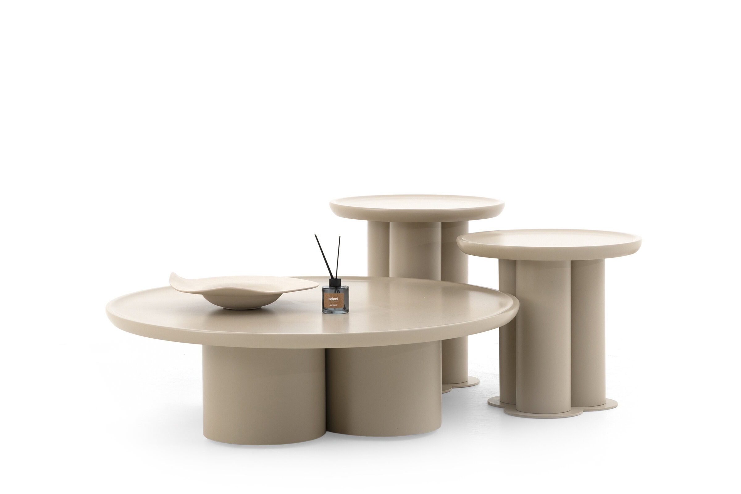 Contemporary beige round coffee tables set with unique cylindrical bases, ideal for modern living spaces and stylish decor.