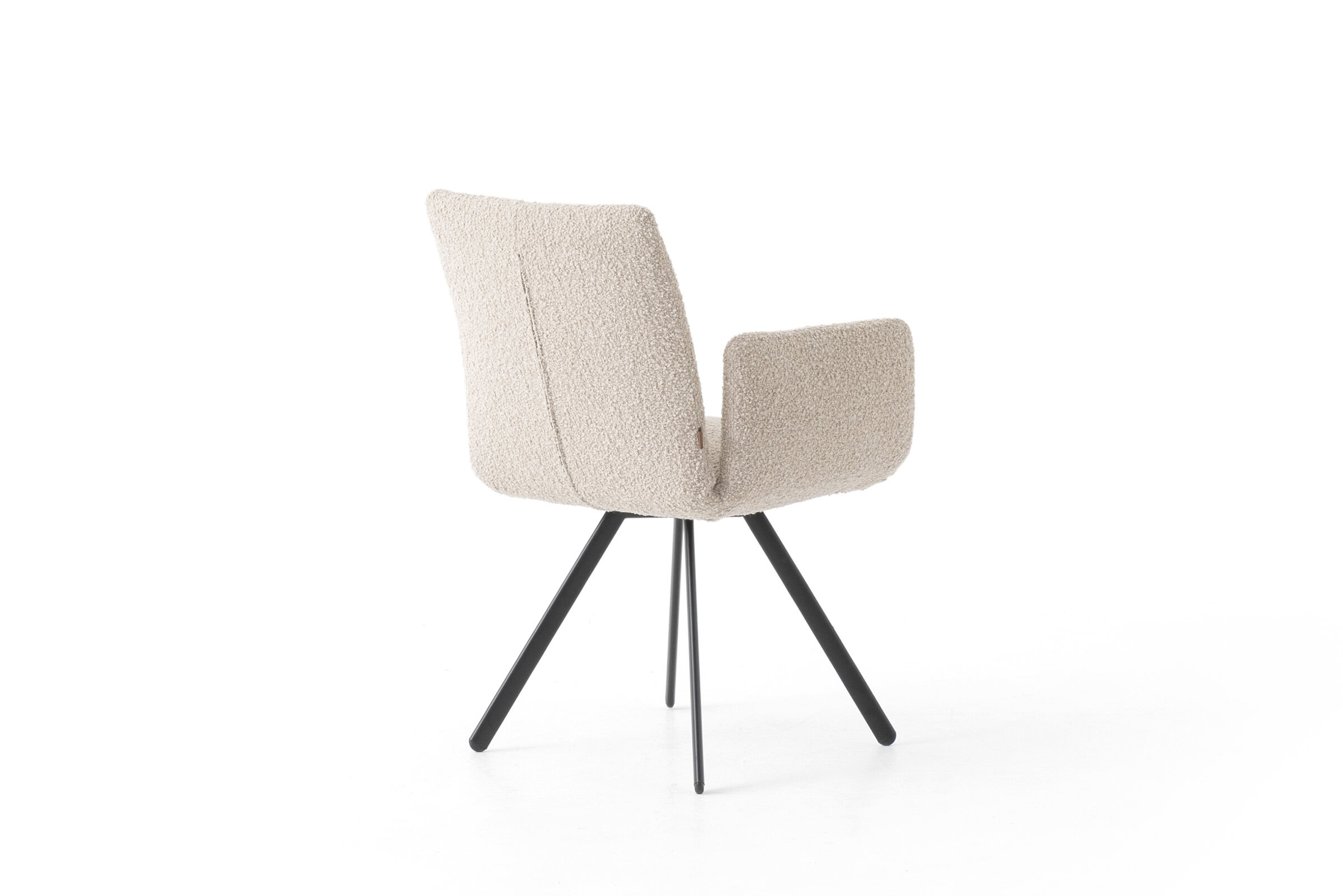 Upholstered armchair with beige fabric and black metal legs, ideal for contemporary living room decor. Comfortable, stylish, and durable furniture piece from Saloni Furniture.