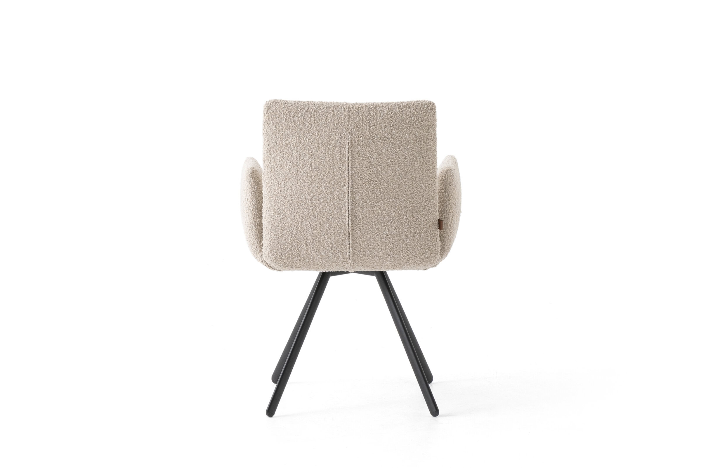 Contemporary beige upholstered armchair with curved armrests and black wooden legs, ideal for stylish living rooms and office spaces.