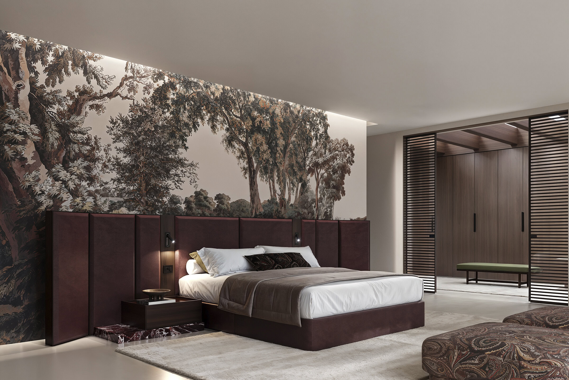 Elegant bedroom featuring a large bed with a deep burgundy headboard, artistic forest mural wall, and contemporary decor. Perfect for stylish, comfortable living spaces.